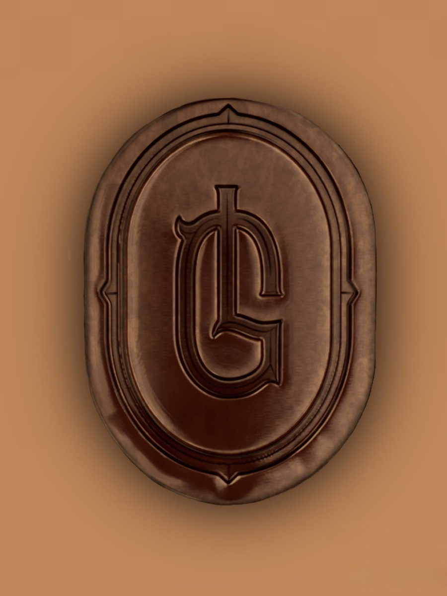 Close-up of the bronze LG seal on the sienna bottle